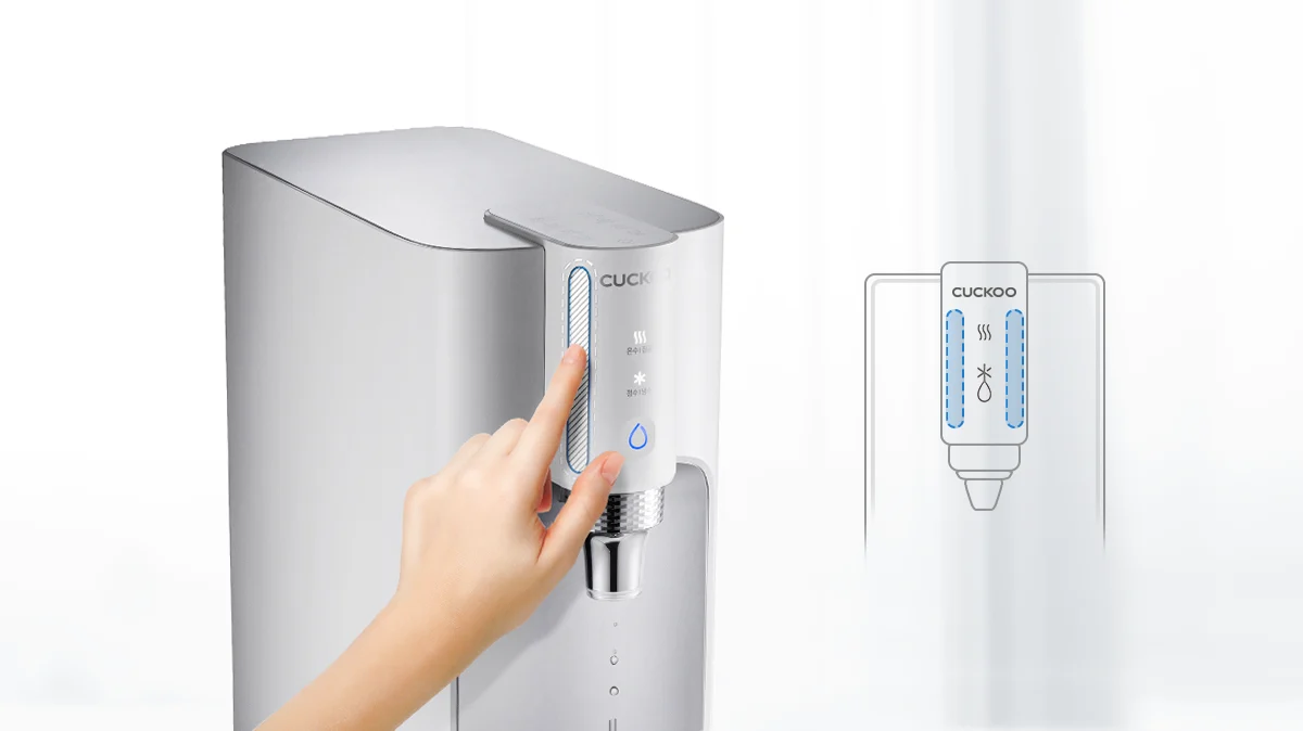 CUCKOO TN100 water purifier with a hand touching the touch-sensitive control panel on top of the unit. (CP-TN100)