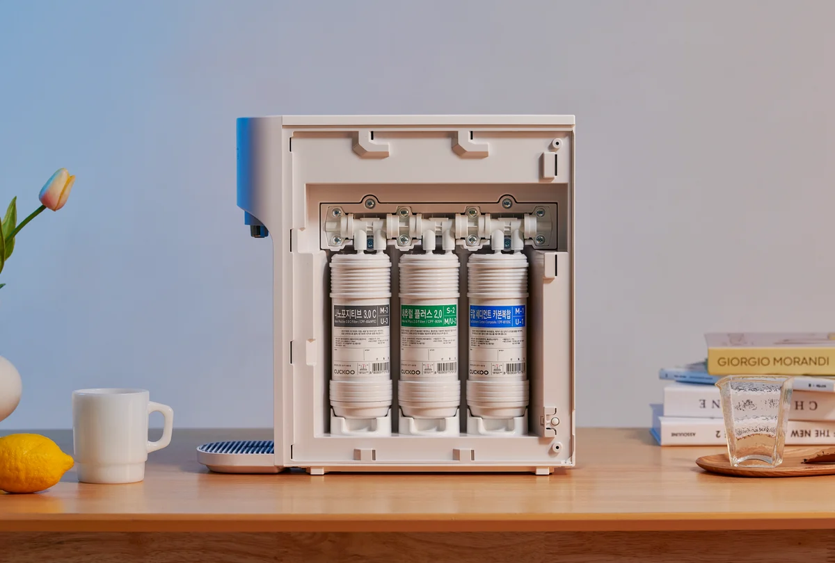 Front view of the NANO+ Signature Water Purifier with its side panel open, displaying the three internal water filters. (CP-AKN011)