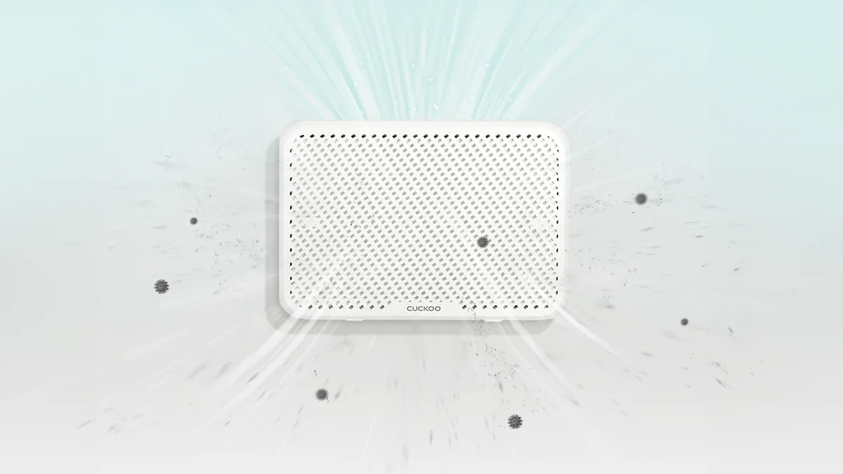 Ultra-slim wall-mounted air purifier drawing in floating dust and particles with visible airflow lines. (CAC-AA0910FW)